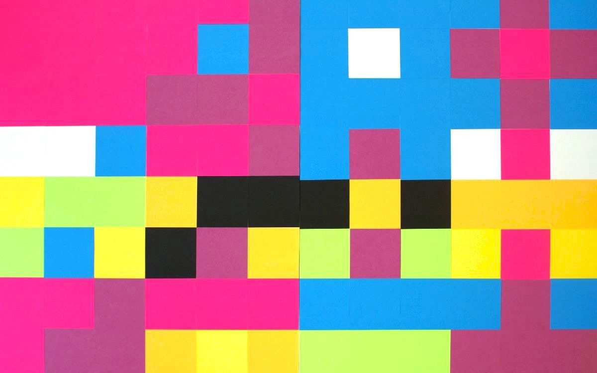 Neon-colored Post-it notes are arranged in a grid, forming pixelated-looking patterns in pinks, purples, yellows, turquoises, black and white.