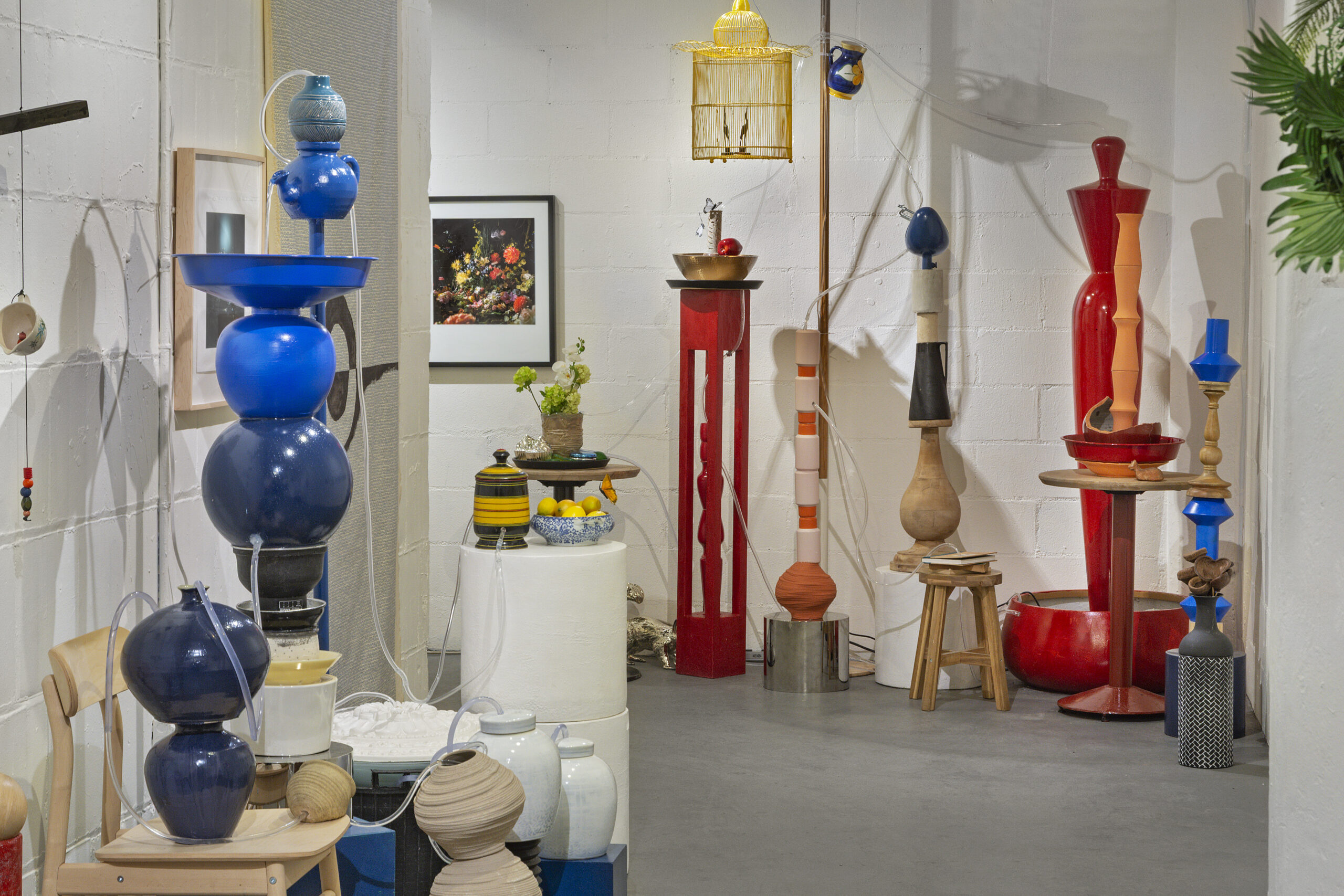 A photo of brightly-colored objects in an installation in a gallery.